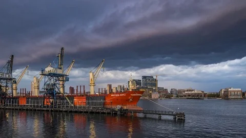 Ship freighter docked as a storm approaches timelapse Stock Footage 82250196