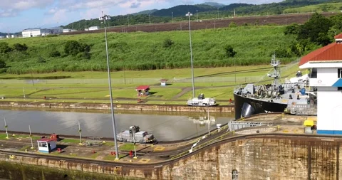 A ship getting pulled through the Panama Canal Stock Footage 205295441