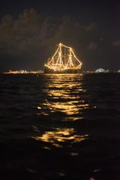 Ship glowing in the sea Stock Photos