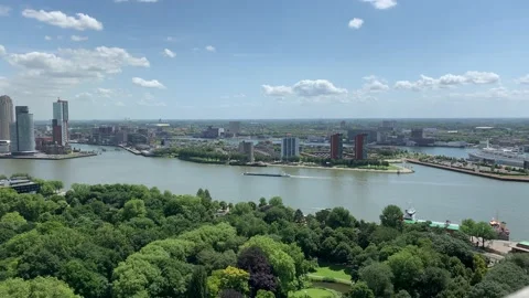 Ship going through Meuse (Maas) river with Rotterdam city skyline. Stock Footage 145031643