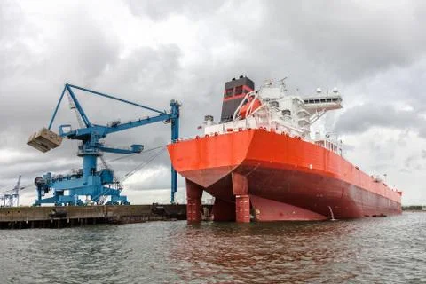 Ship in the harbor on a cloudy day Stock Photos