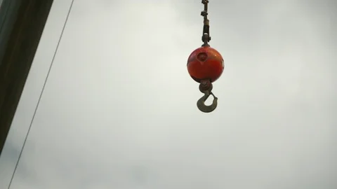 Ship hooks hanging from a crane Stock Footage 117731922