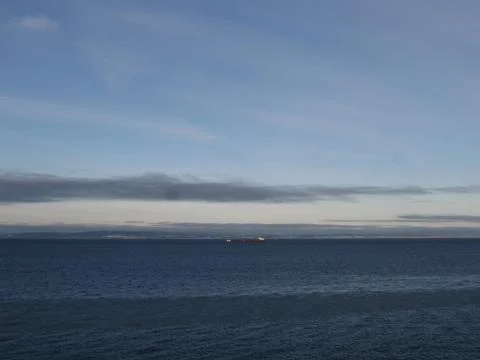 Ship on the horizon Stock Photos