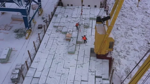 The ship is loaded in port in the winter by timber. Stock Footage 148763383