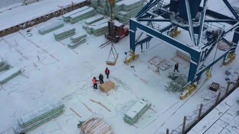 The ship is loaded in port in the winter by timber. Stock Footage 149083211