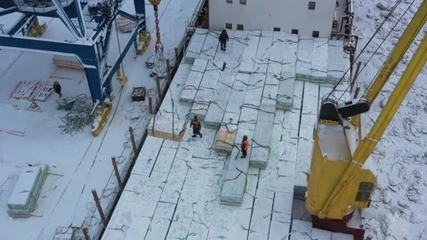 The ship is loaded in port in the winter by timber. Stock Footage 149083406