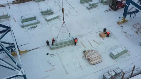 The ship is loaded in port in the winter by timber. Stock Footage 149380858