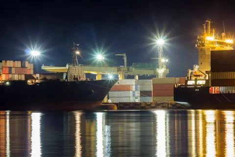 Ship loading work in the container terminal in Riga, Latvia in the summer nig Stock Photos