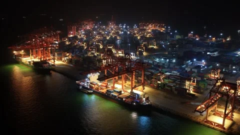 Ship logistics night time lapse. Sea port boat load cargo containers timelapse. Stock Footage 340646696