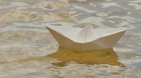 Ship Made of White Paper is Floating by Water Childish Amusement Game Dream 動画素材 64774093
