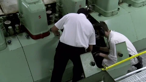 Ship mechanic working on massive cruise ship engine Stock Footage 81079756