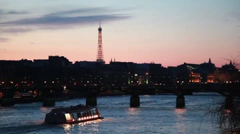 Ship moves on river to iron bridge of night in Paris Stock Footage 2299615