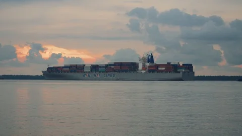 Ship moving and docking during sunset at Port Klang Stock Footage 99795922