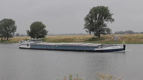 Ship moving by river during gloomy daytime. Netherlands Stock Footage 245407460