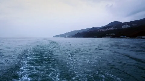 Ship is moving on the sea leaving behind a water trace Vídeo Stock 84744149
