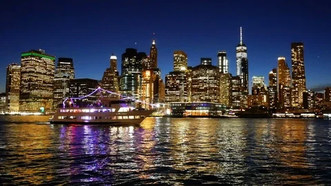 Ship navigating Hudson River Cityscape Manhattan New York City at night Stock Footage 91626819