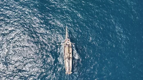 Ship navigating the open ocean, sun glitter, aerial view, 4k Stock Footage 254584490