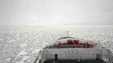 Ship navigating in pancake ice at Antarctica Stock Footage 100251150
