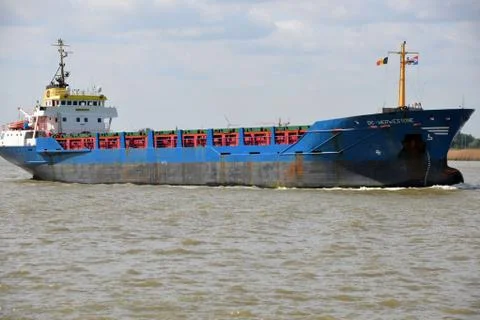 A ship navigating on a river Stock Photos