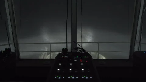 Ship at night. View from Navigation bridge back to wake. Control panel is Stock Footage 271157758