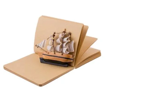 Ship on a notebook Stock Photos