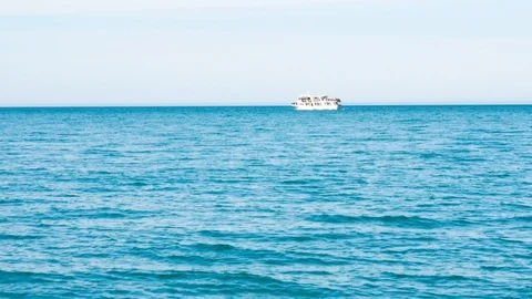 Ship in the ocean moves from right to left Stock Footage 104956792