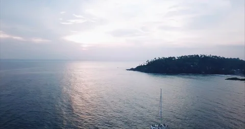 Ship in the ocean at the pink sunset. Drone shot Stock Footage 130083128