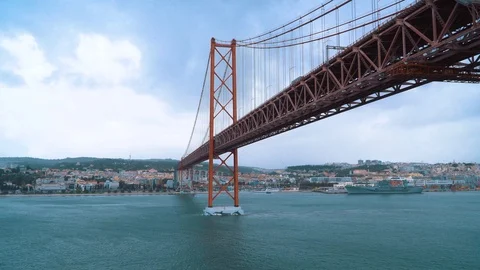 Ship passage under the April 25th bridge Lisbon Portugal Stock Footage 126010081