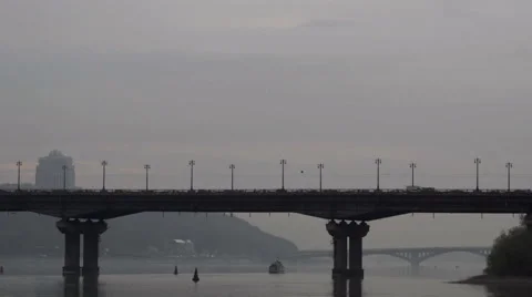 A ship passes under the bridge on the river Stock Footage 62464971