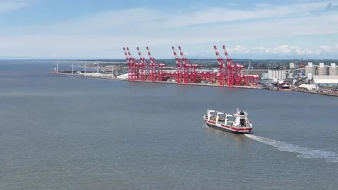 Ship passing in front of Liverpool UK container port drone aerial view Stock Footage 336009833