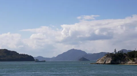 Ship Passing Lighthouse in Japan’s Seto Inland Sea Stock Footage 45604638