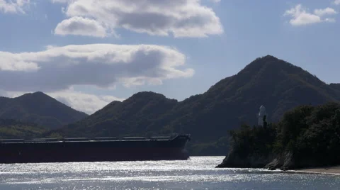 Ship Passing Lighthouse in Japan’s Seto Inland Sea Stock Footage 45605894