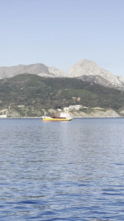 Ship passing by the Moroccan coast seen from Ceuta Port Stock Footage 311833105