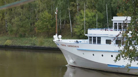 Ship is passing by the river from right to left Stockbeeldmateriaal 36169119