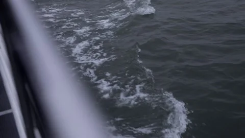 Ship passing through wavy water with high current. Stock Footage 135798384
