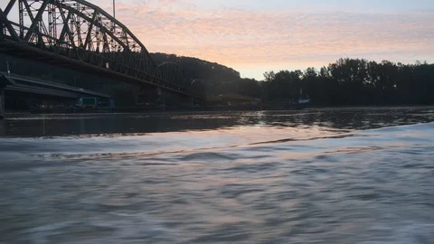 Ship passing under bridges at sunset Stock Footage 115946200