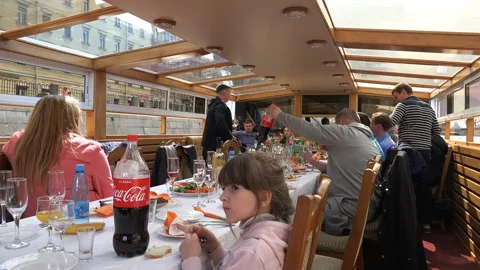 On a ship people sit at a festive table Stock Footage 94157746