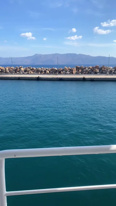 A ship pulls away from the dock.  Vertical video Stock Footage 287234580