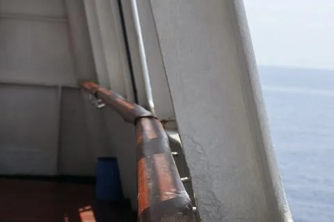 Ship Railing and Structural Beam Over Open Sea Stock Photos