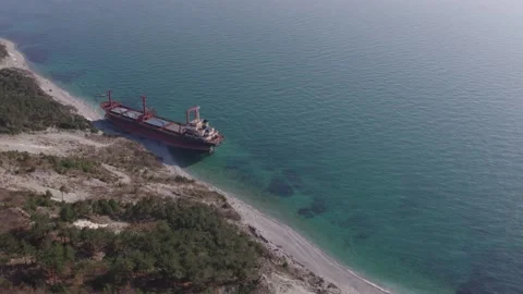 The ship ran aground. Environmental pollution at sea. Aerial view. grounded ship Stock Footage 136464551