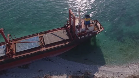 The ship ran aground. Environmental pollution at sea. Aerial view. grounded ship Stock Footage 137651812
