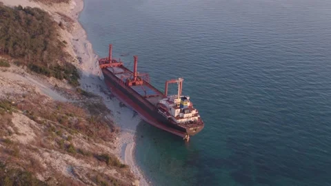 The ship ran aground. Environmental pollution at sea. Aerial view. grounded ship Stock Footage 137656035