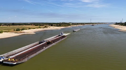 Ship on the river Waal during summer drought seen from above Stock Footage 342109872