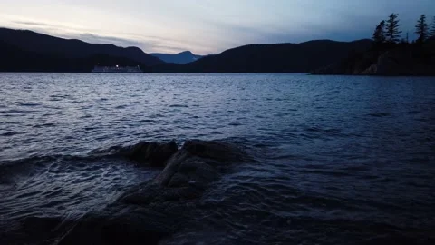 Ship Rocks And Mountain In Ocean - Middle Shot Stock Footage 162004708