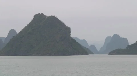 Ship sailing between mountain islands, Hạ Long Bay, North Vietnam Stock Footage 53433086