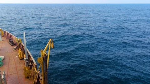 Ship sailing in blue sea in daytime. Top view of ocean. Video stock 275568169