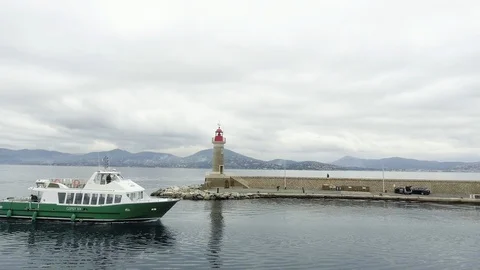 Ship sailing near lighthouse Stock Footage 86565756
