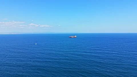 Ship sailing on the ocean under a clear blue sky during daytime Stock Footage 344808836