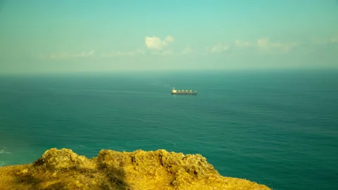Ship sailing in the ocean. View from the Cliff. 4K. Time lapse. Stock Footage 115488323