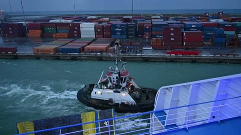 Ship Is Sailing To Port helped by a pilot boat, at dawn 스톡 동영상 165365336
